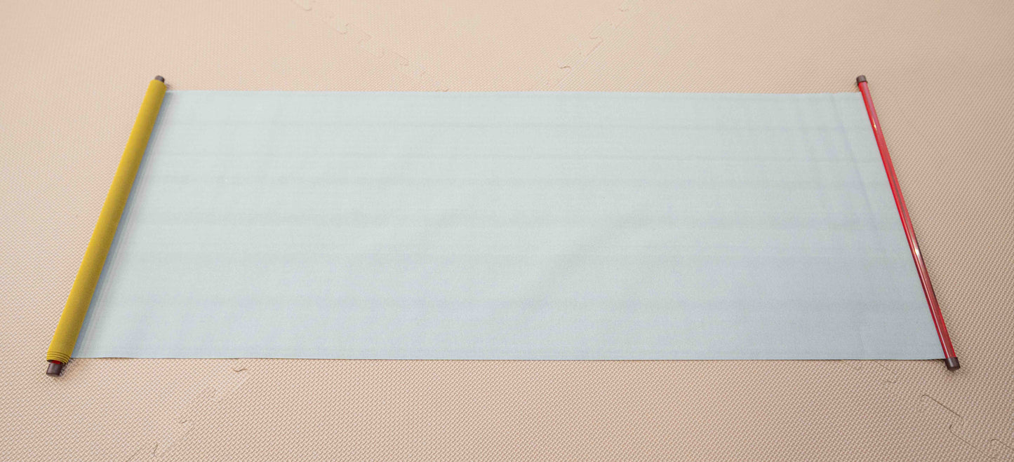 child drawing on reusable water drawing mat without mess